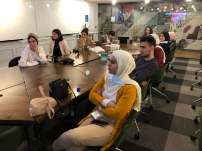 People at a meeting sitting at a conference table