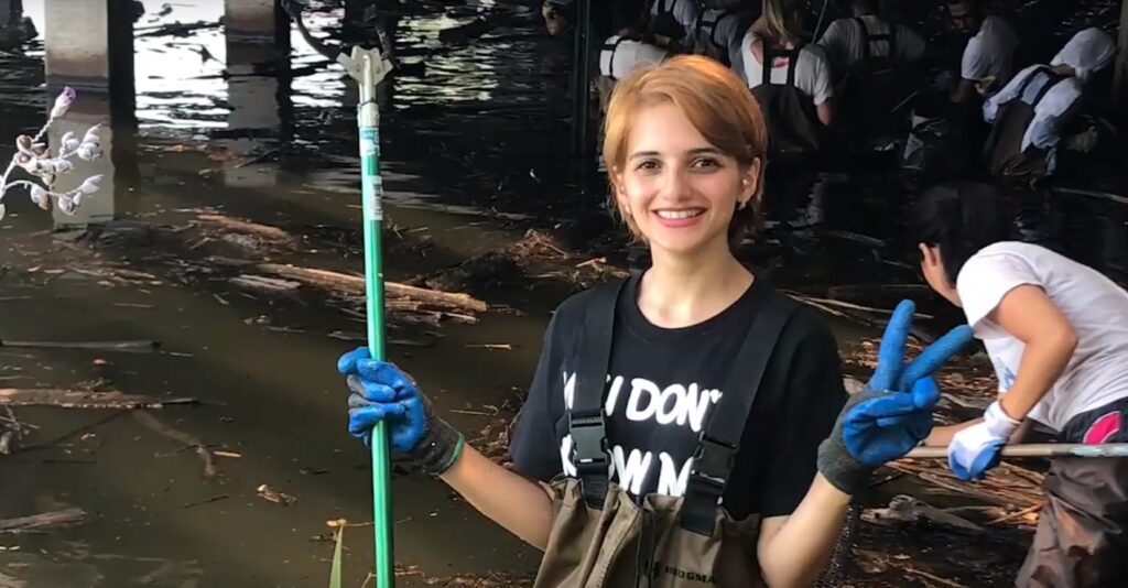 Lady helping clean up flooded area