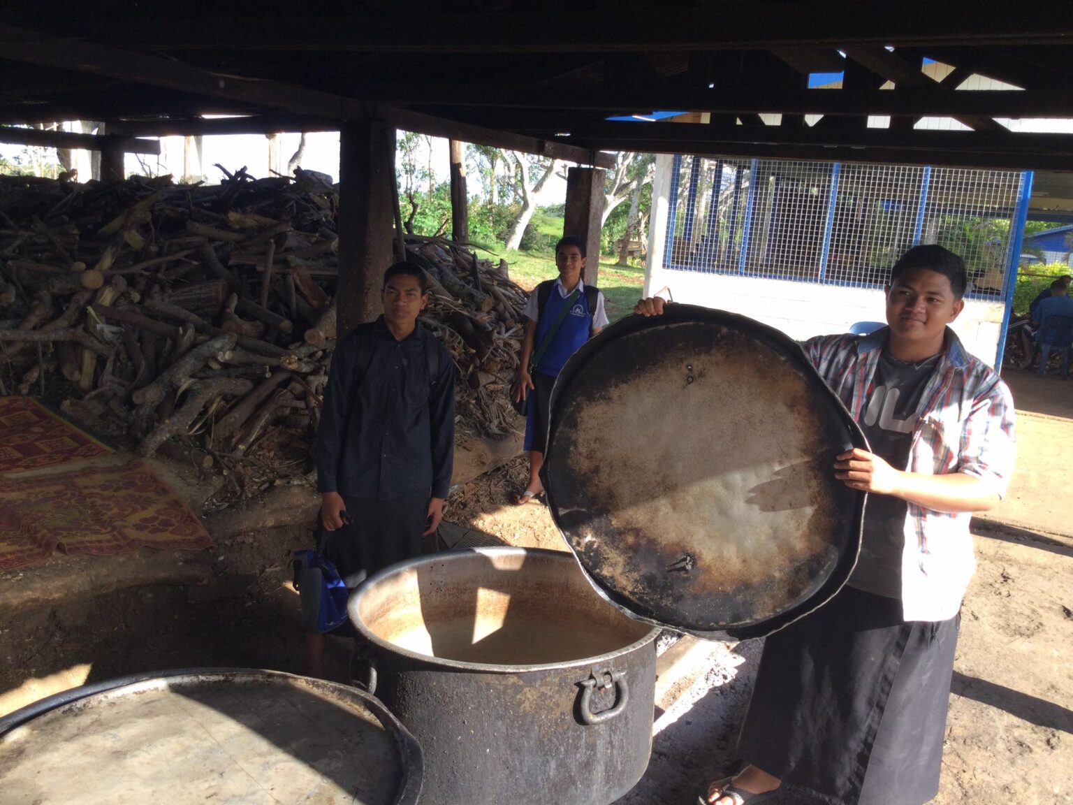 group of boys doing work outside