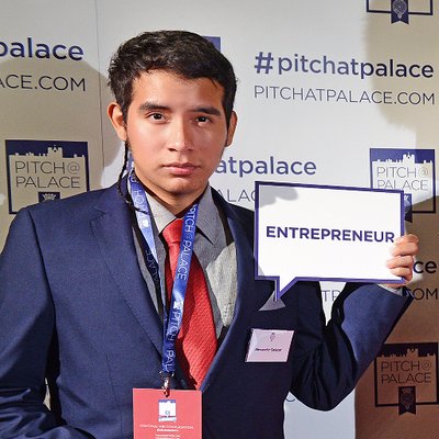 Boy holding a sign at a conference