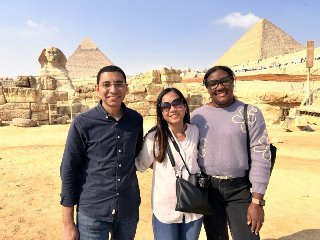 20241115-090710234-iOS-jpeg--2048x1536 - Legacy International (from left to right) Egyptian PFP Alumnus Amir Rahal, Dalin, and Maria in front of the Pyramids and Great Sphinx of Giza.